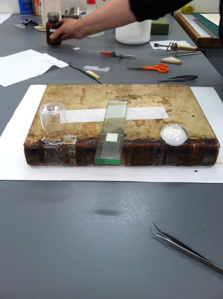 Left to Right: a solvent chamber, direct application of solvent-soaked blotter to tape, plaster chamber.