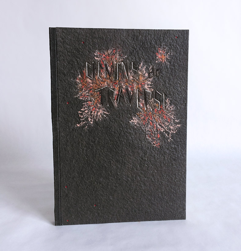 Front cover of Chemins De Traverse binding on a white table.