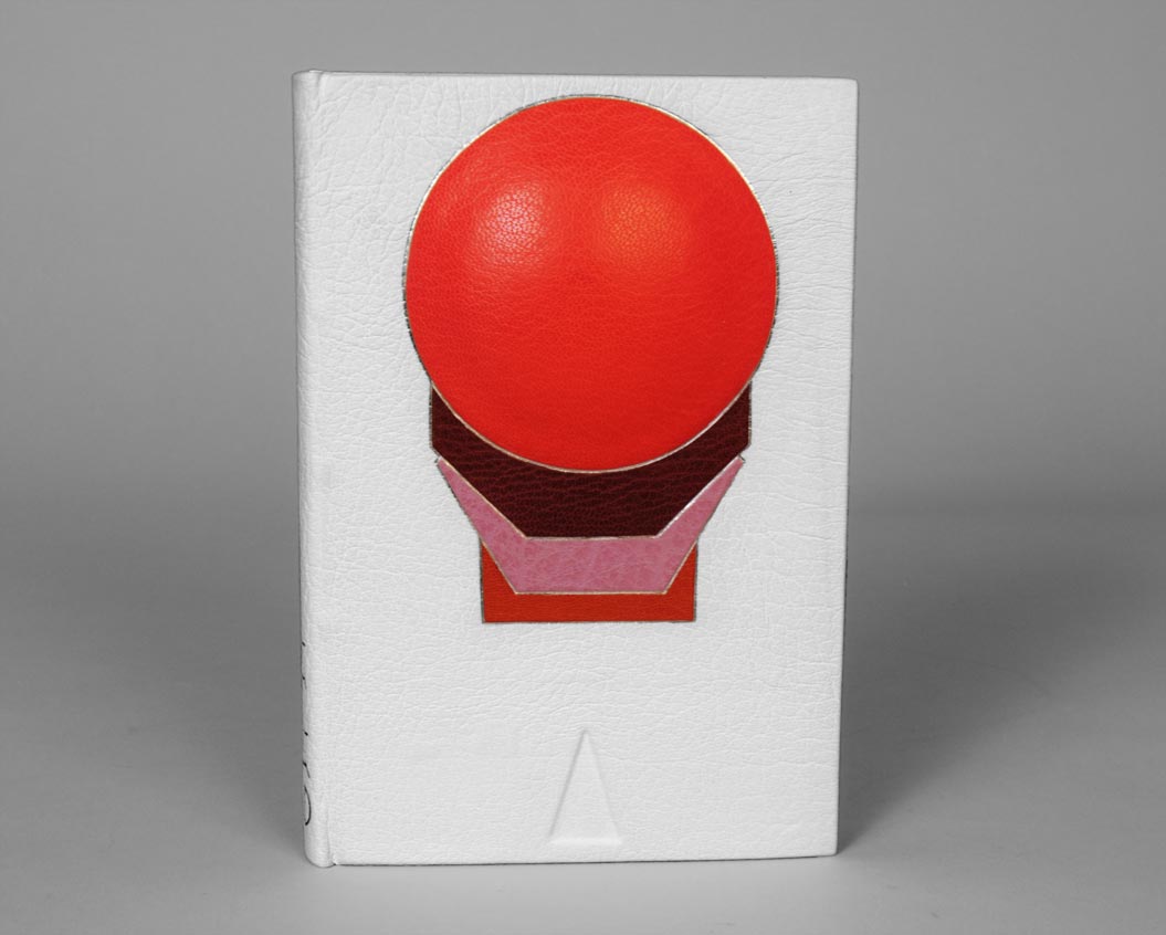 Front cover of Flatland: A Romance of Many Dimensions binding on a white table.