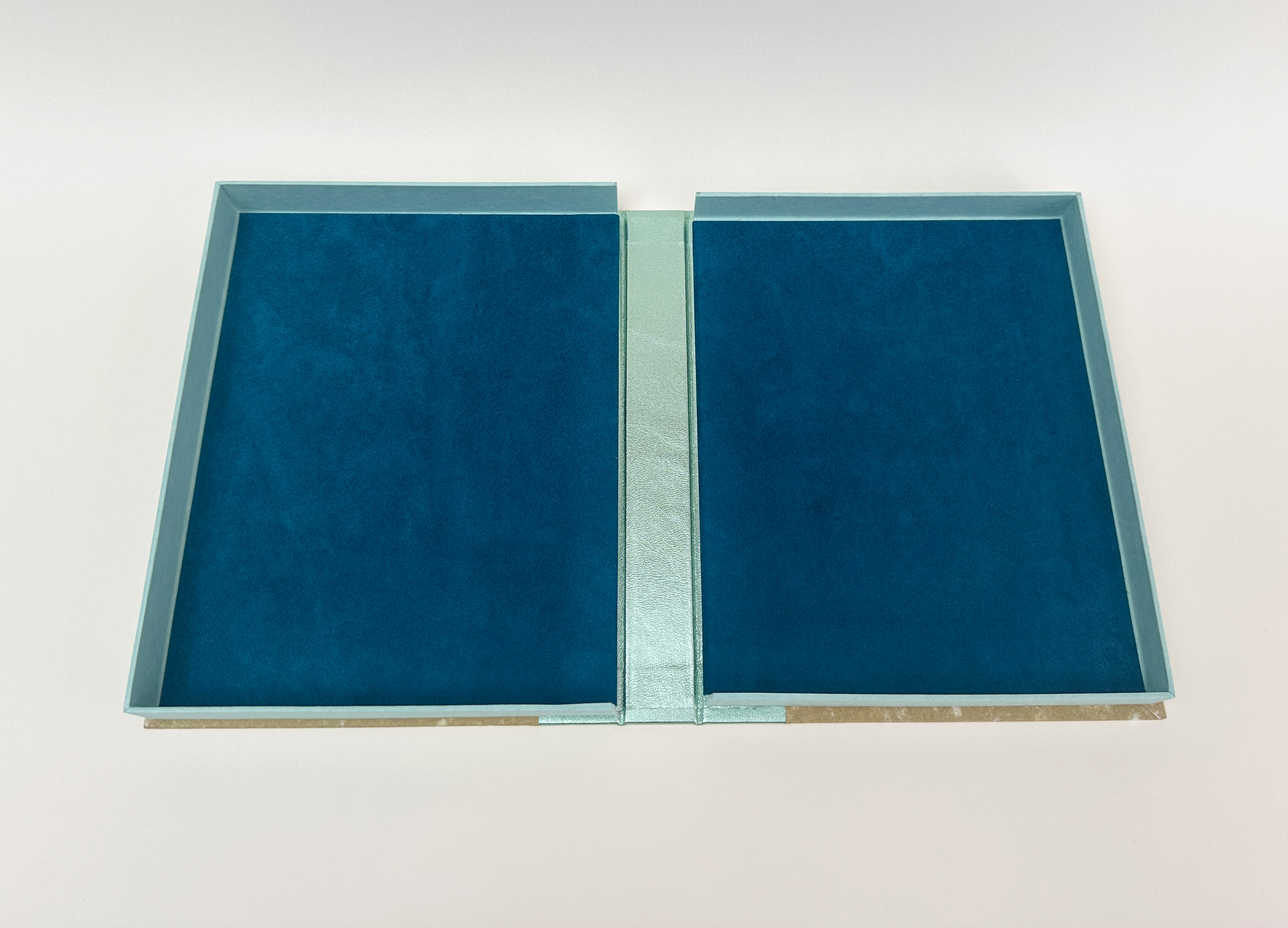 Box interior of An Idea of Geometry on a white table.