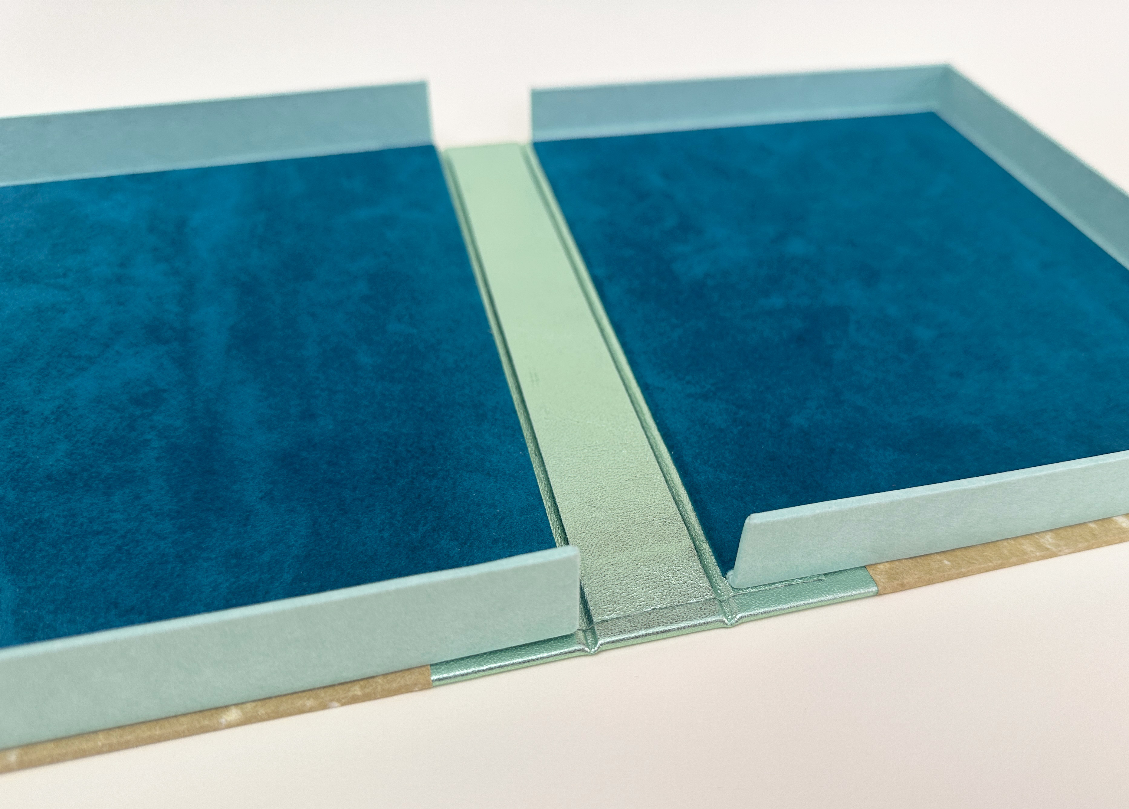 Box interior detail of An Idea of Geometry on a white table.