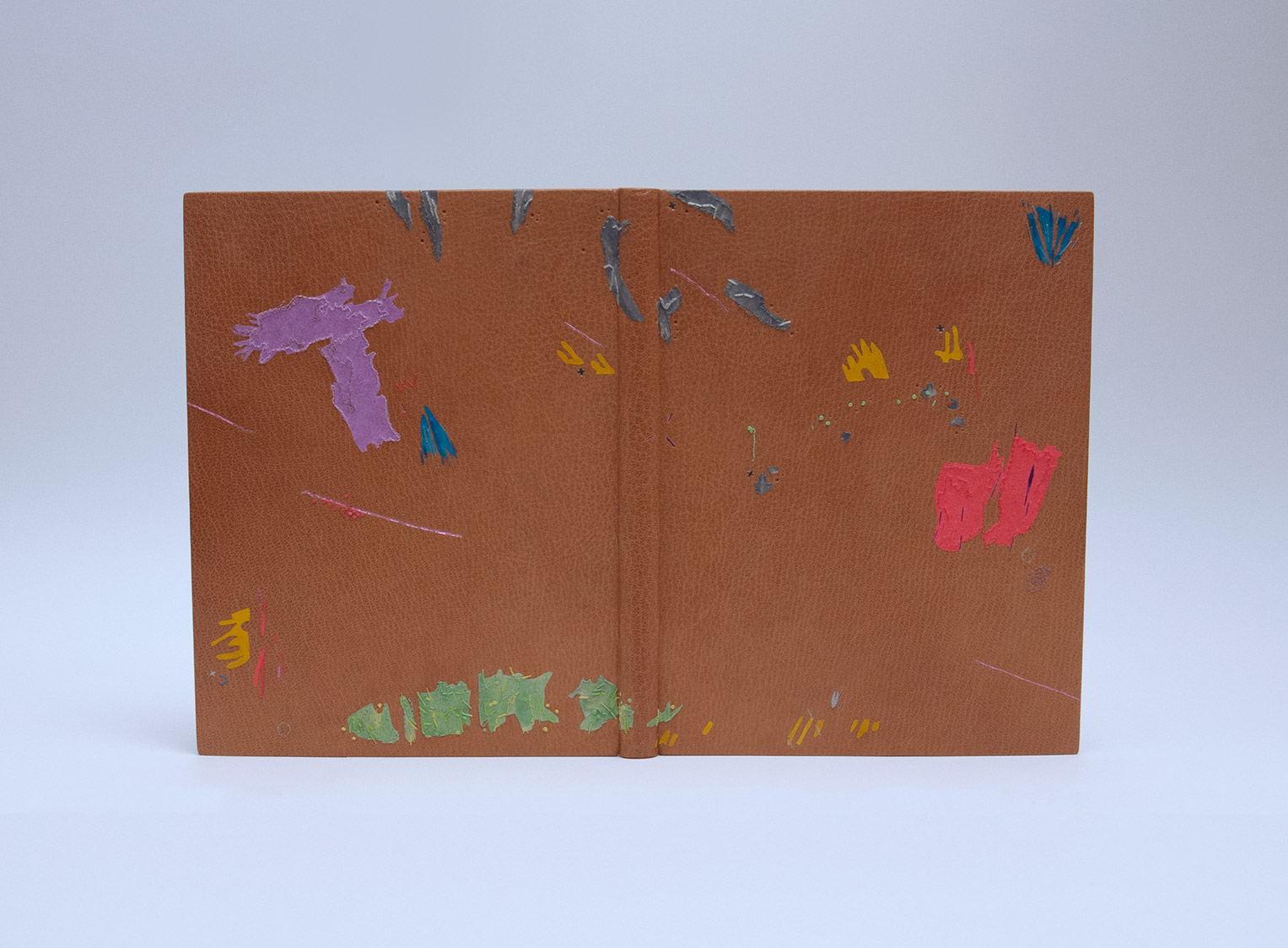 Front cover of Happy Abstract: A letter from William Blake to Thomas Butts binding on a white table.