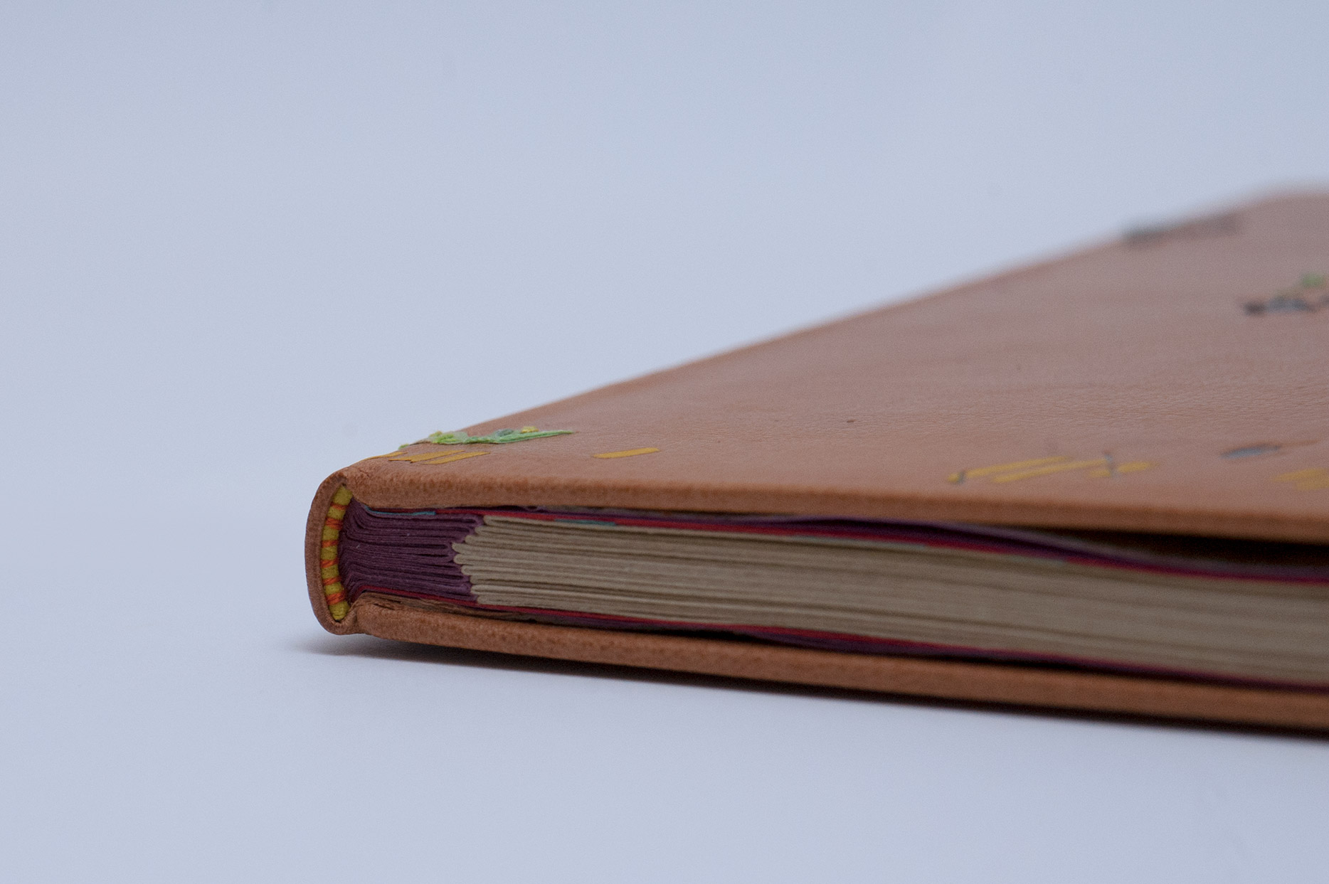Edge of Happy Abstract binding on a white table.