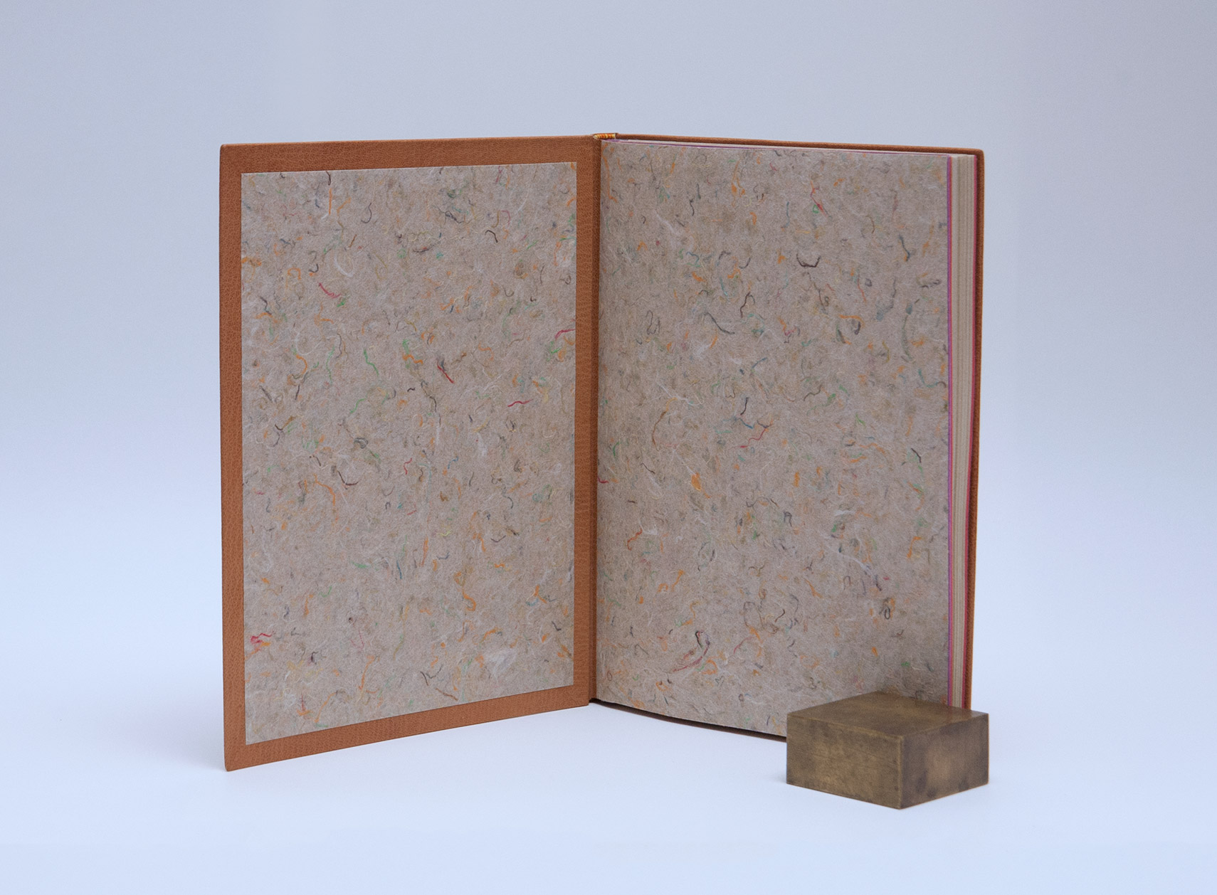 Interior of Happy Abstract binding on a white table.