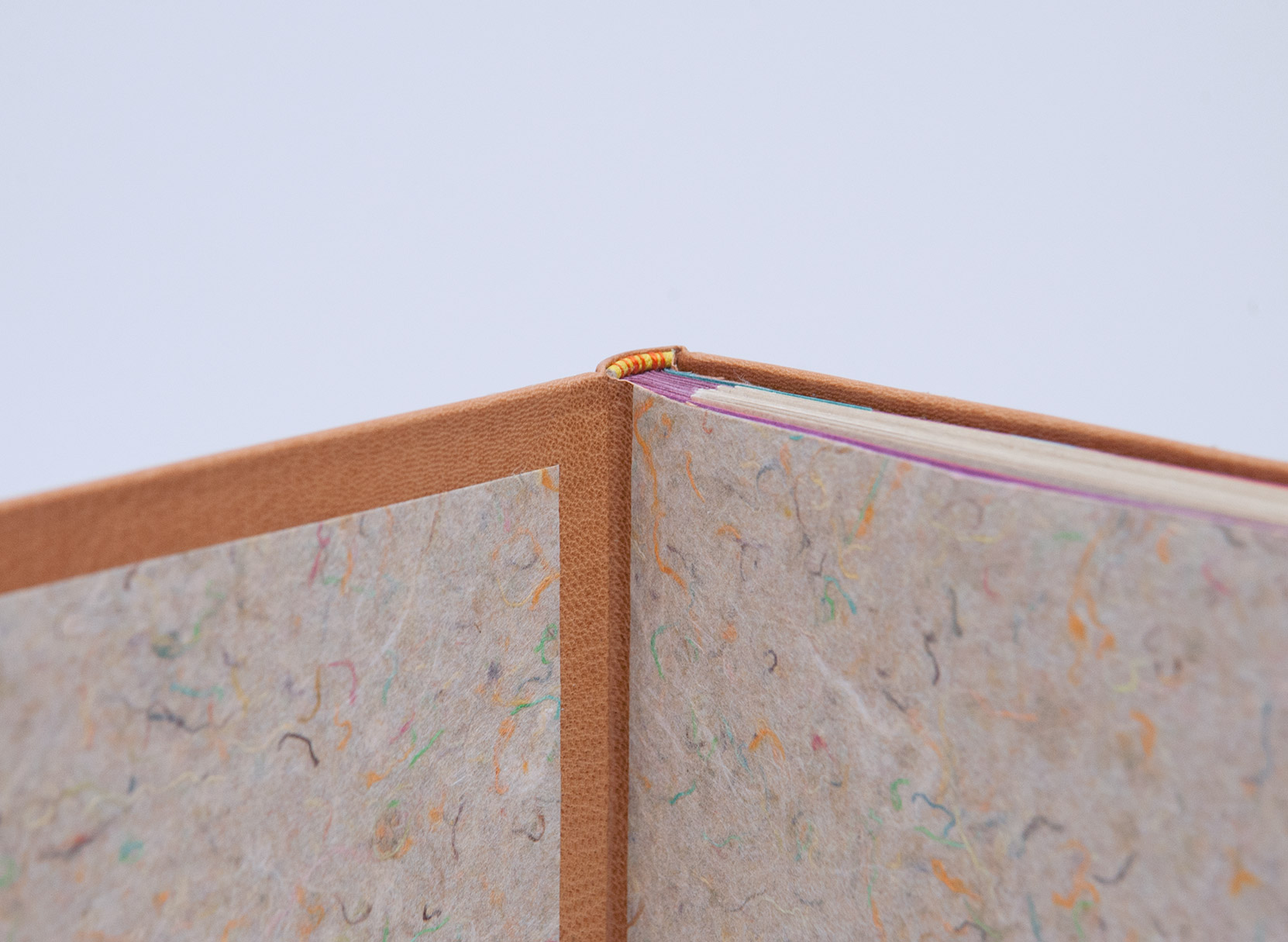 Close-yp of interior of Happy Abstract binding on a white table.