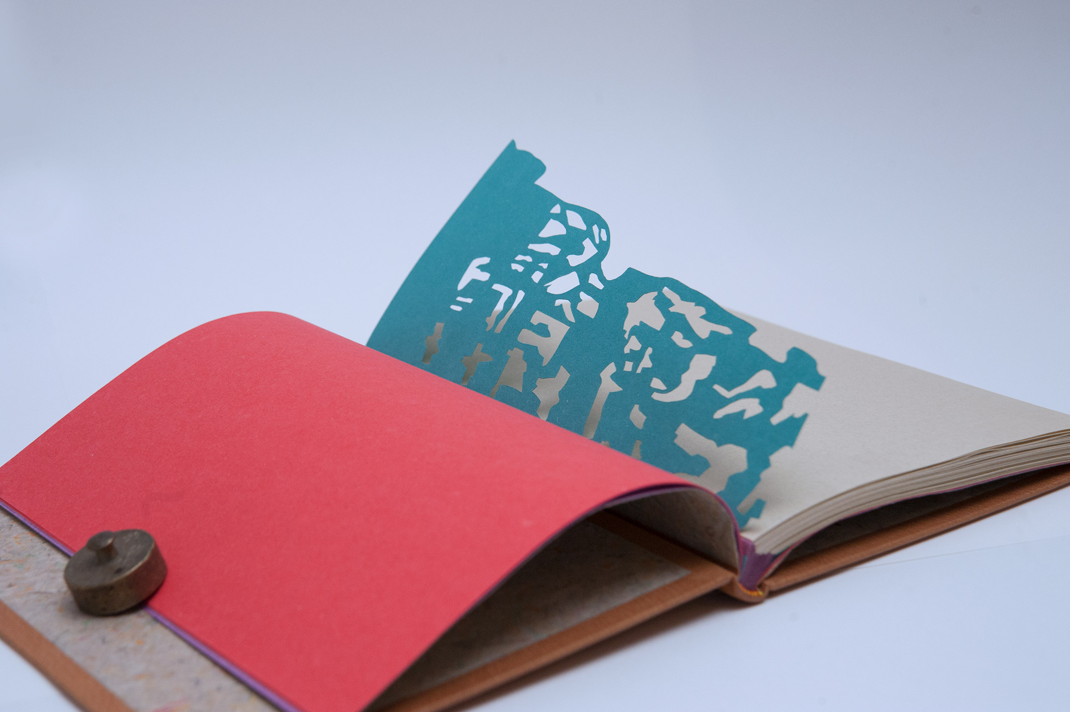 Interior of Happy Abstract binding on a white table.