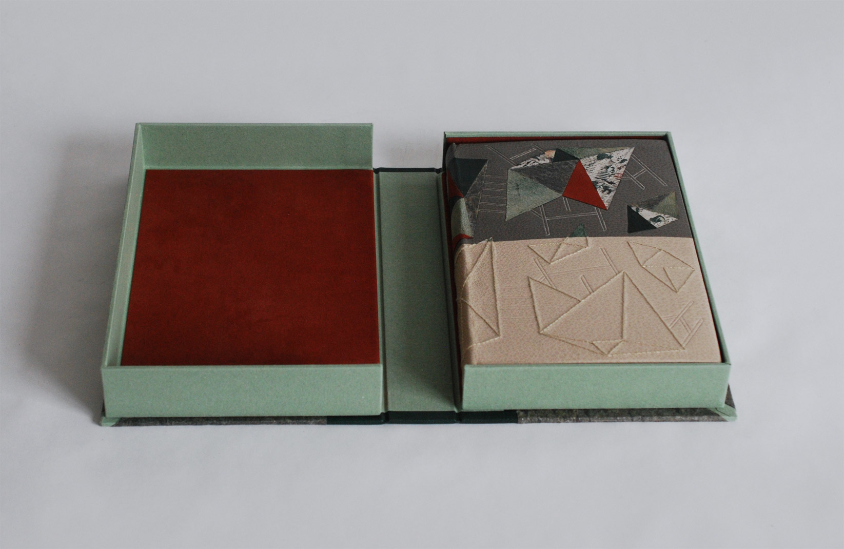 Box interior of Invisible Cities binding on a white table.