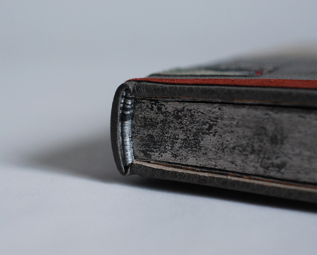 Edge of Invisible Cities binding on a white table.