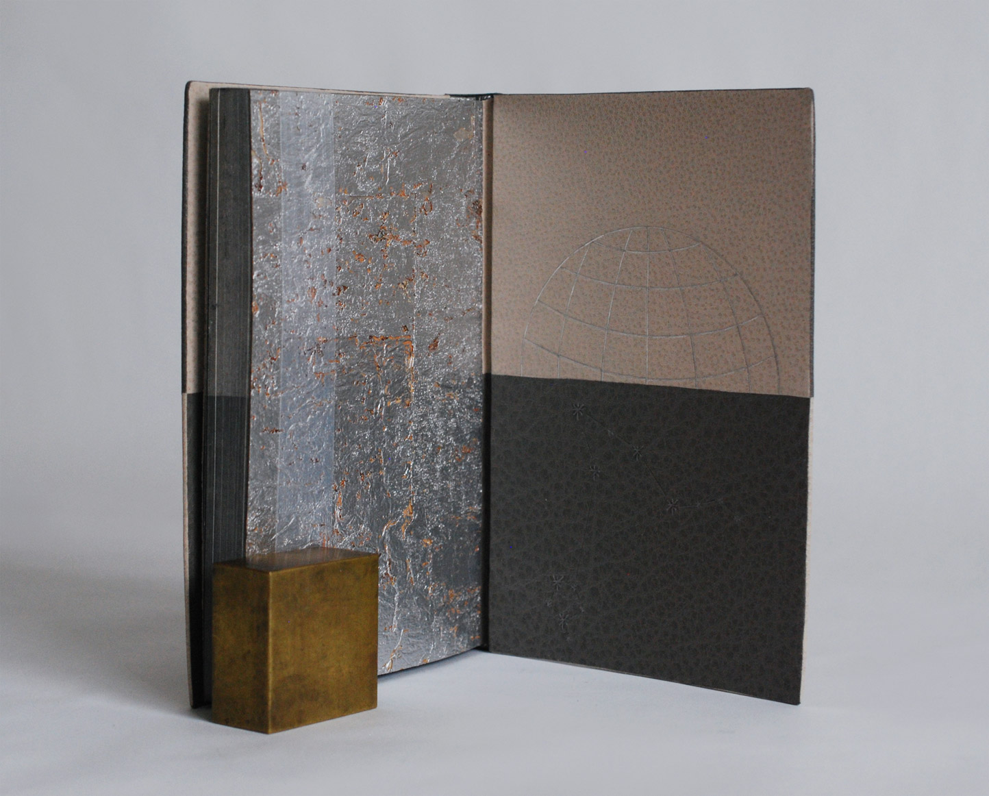 Interior of Invisible Cities binding on a white table.