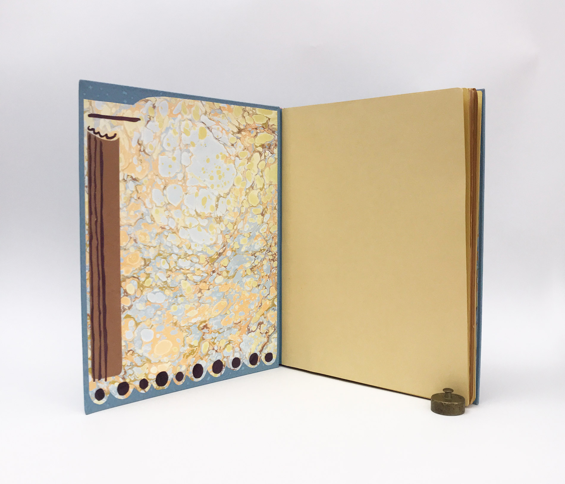 Interior of Kew Gardens binding on a white table.