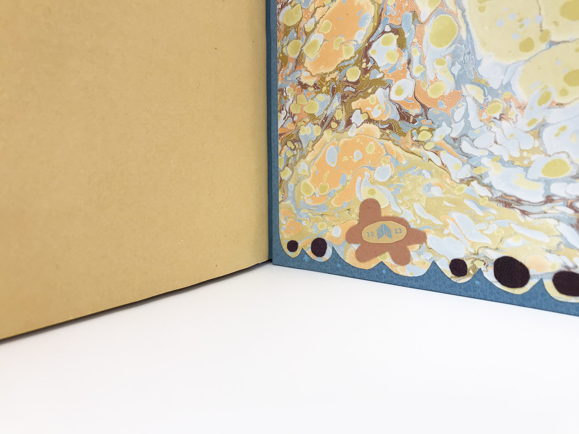 Close-up of interior of Kew Gardens binding on a white table.