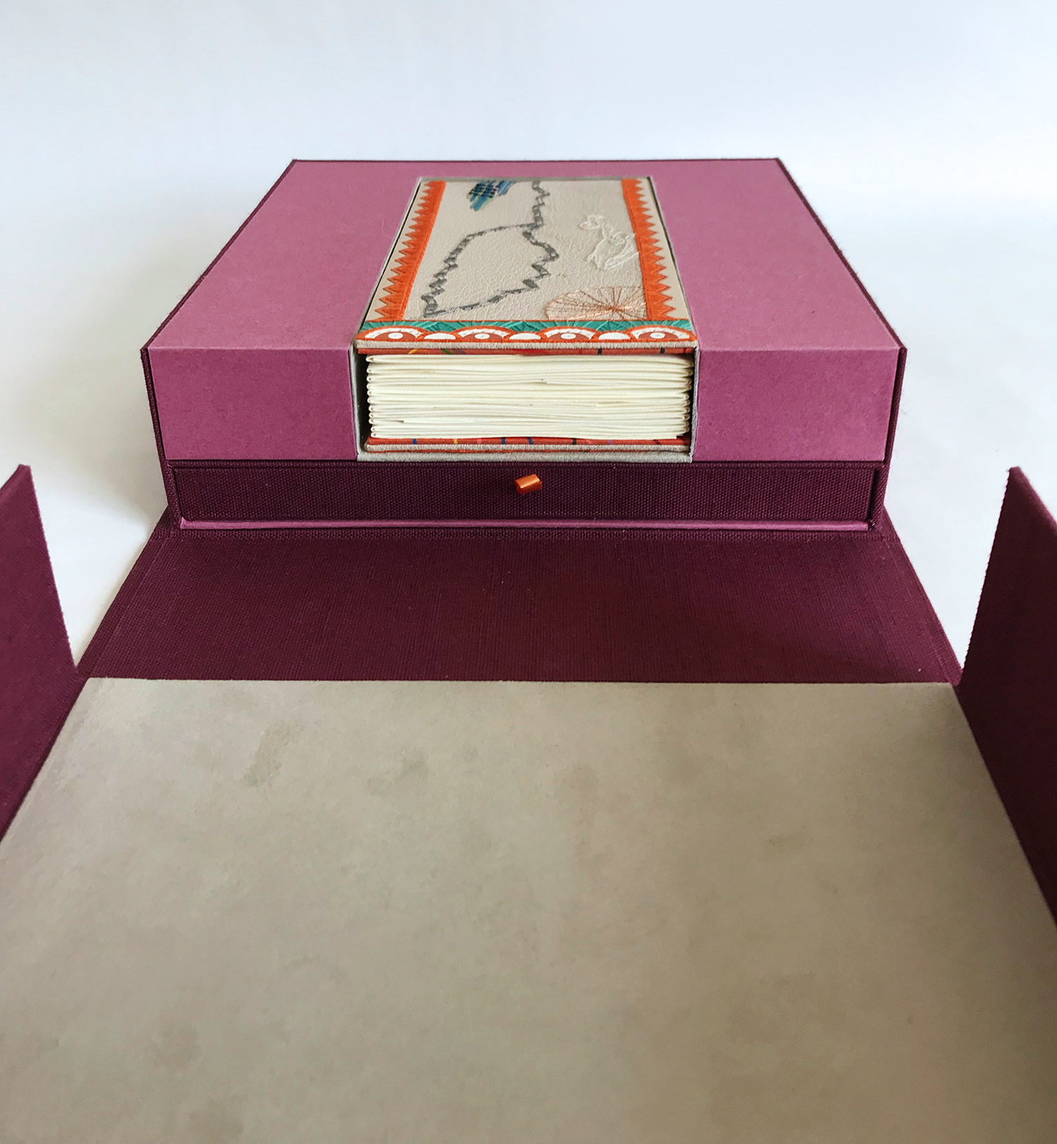 Box interior of La Prose du Transsibérien binding on a white table.