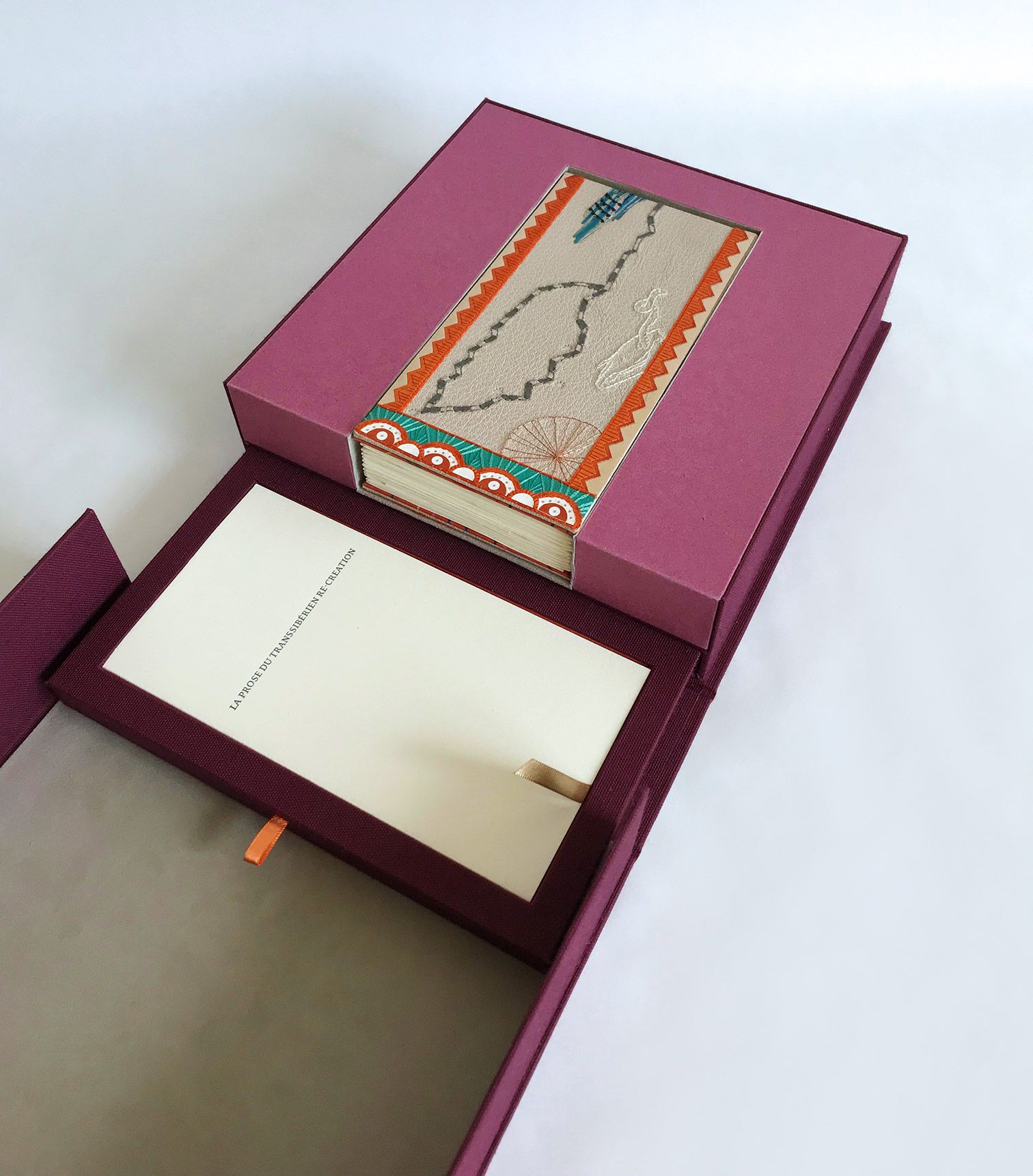 Box interior of La Prose du Transsibérien binding on a white table.
