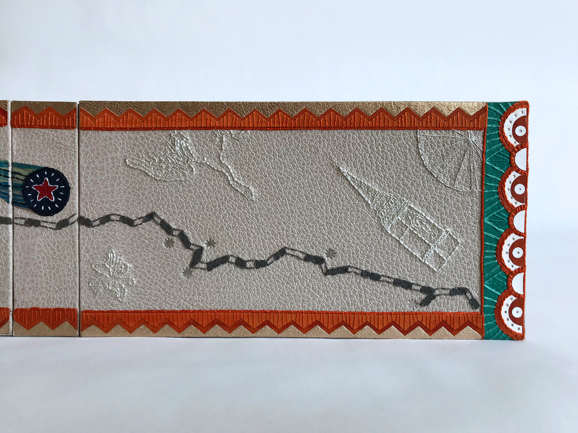 Close-up of front cover of La Prose du Transsibérien binding on a white table.