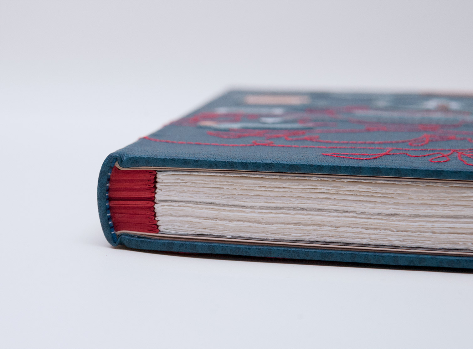 Edge of The Private Typecasters binding on a white table.