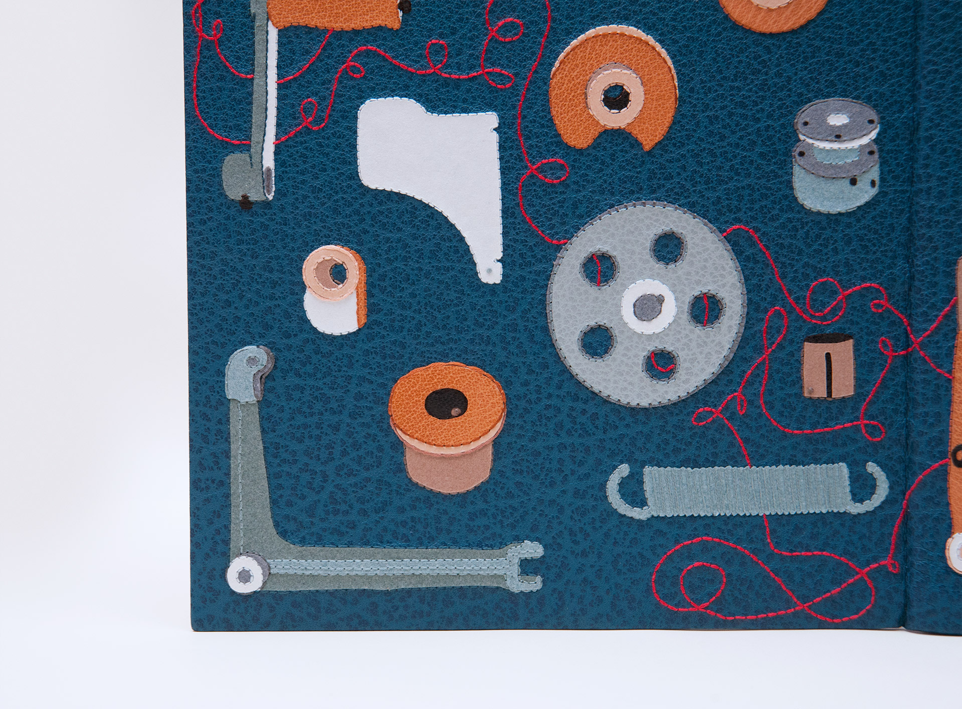 Close-up of front cover of The Private Typecasters binding on a white table.