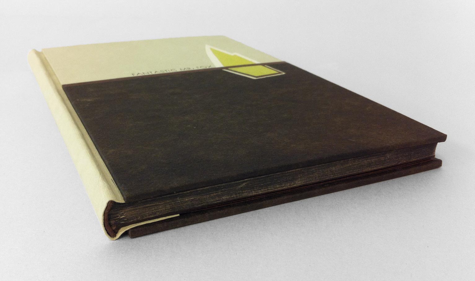 Edge of Fantastic Mr. Fox binding on a white table.