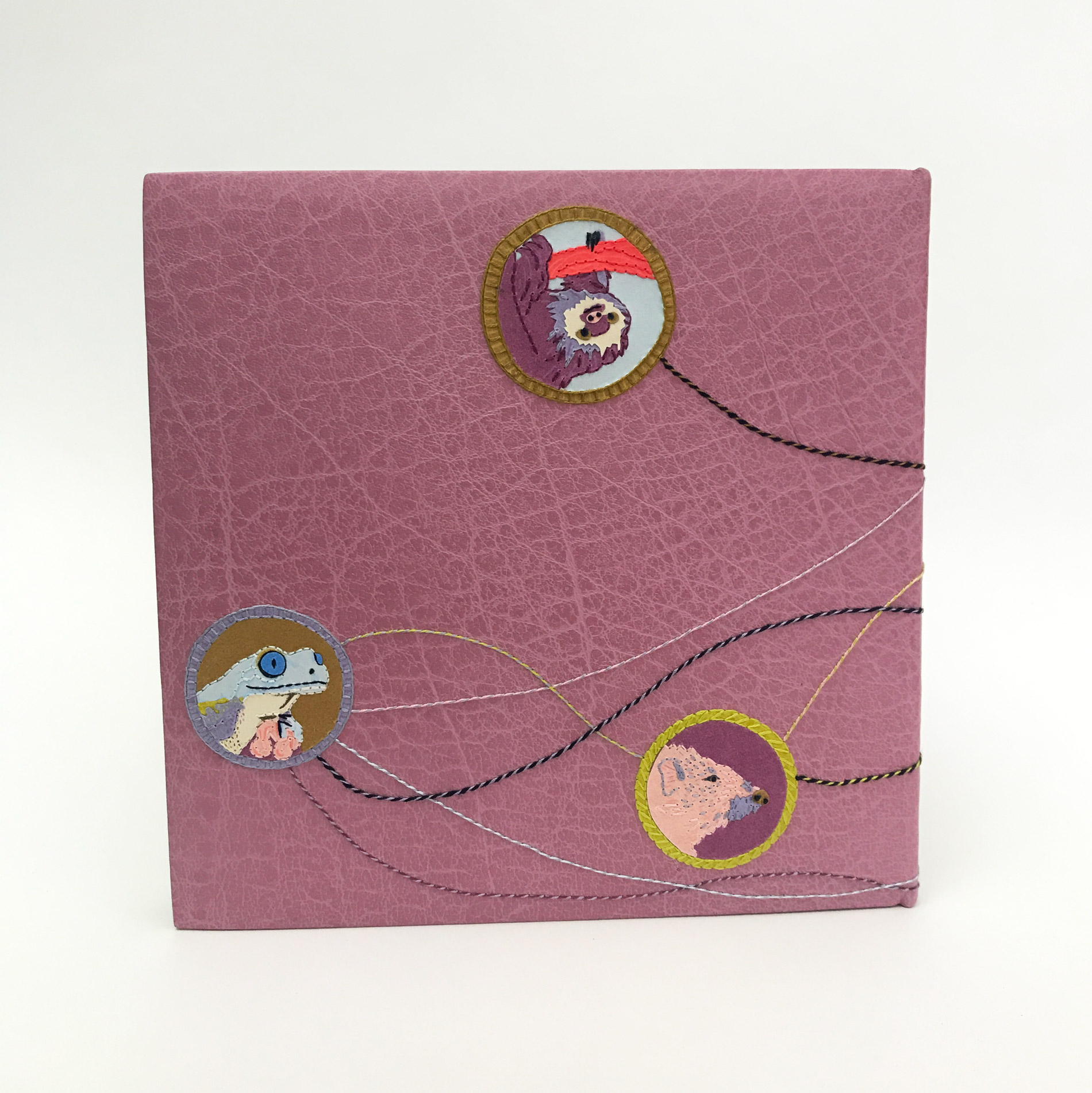 Back cover of The Seven Deadly Sins binding on a white table.