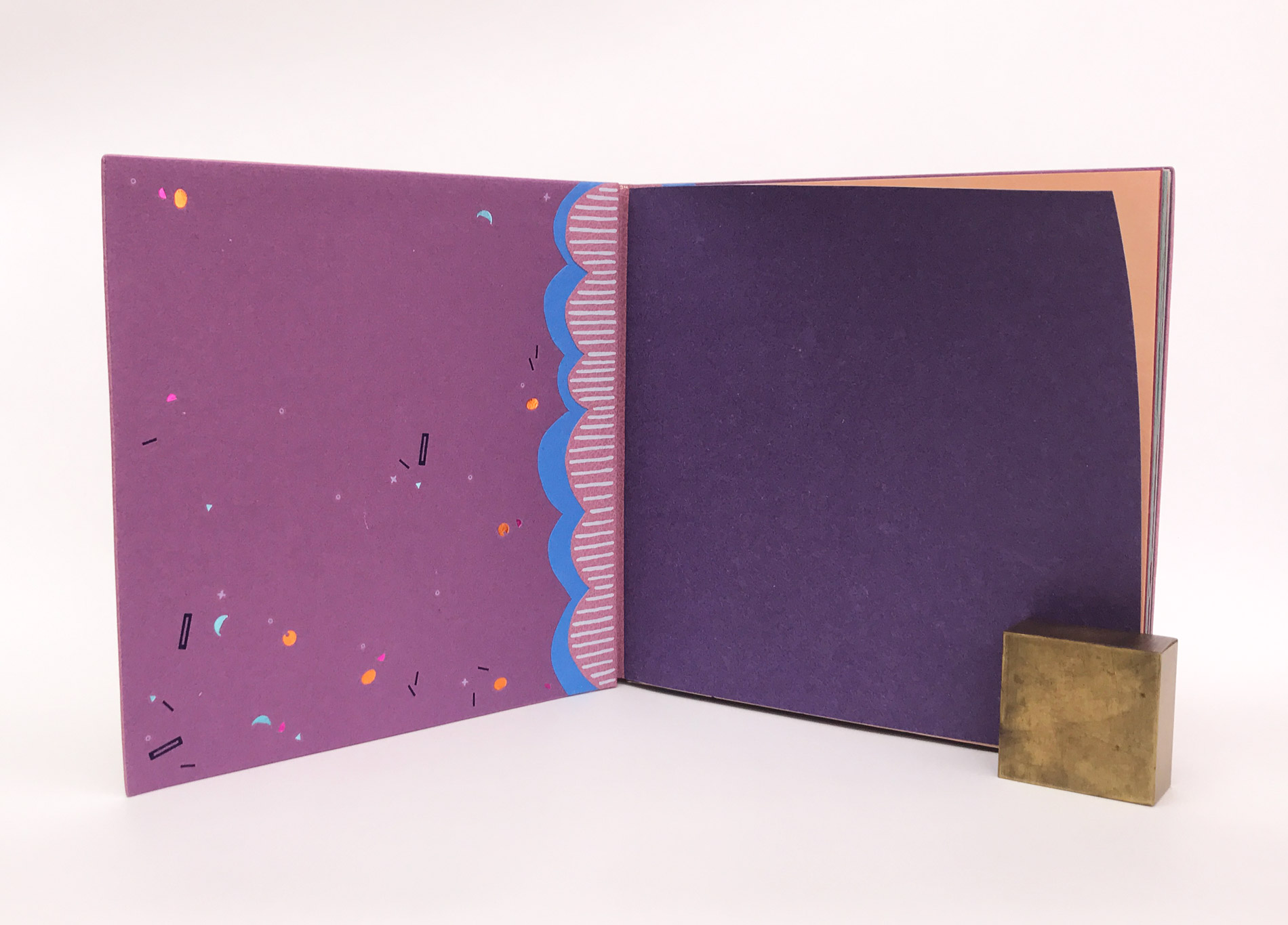 Interior of The Seven Deadly Sins binding on a white table.