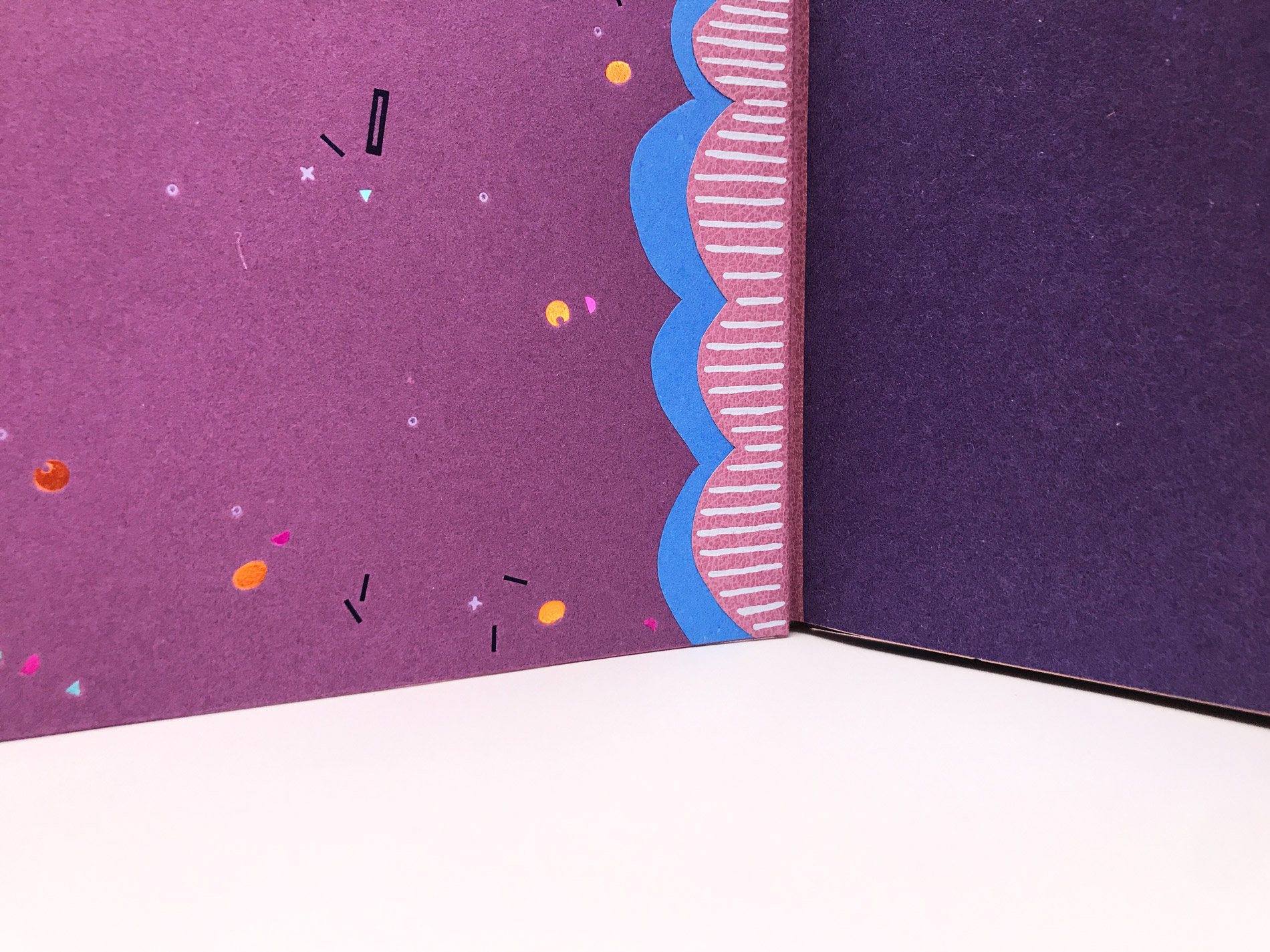 Interior of The Seven Deadly Sins binding on a white table.