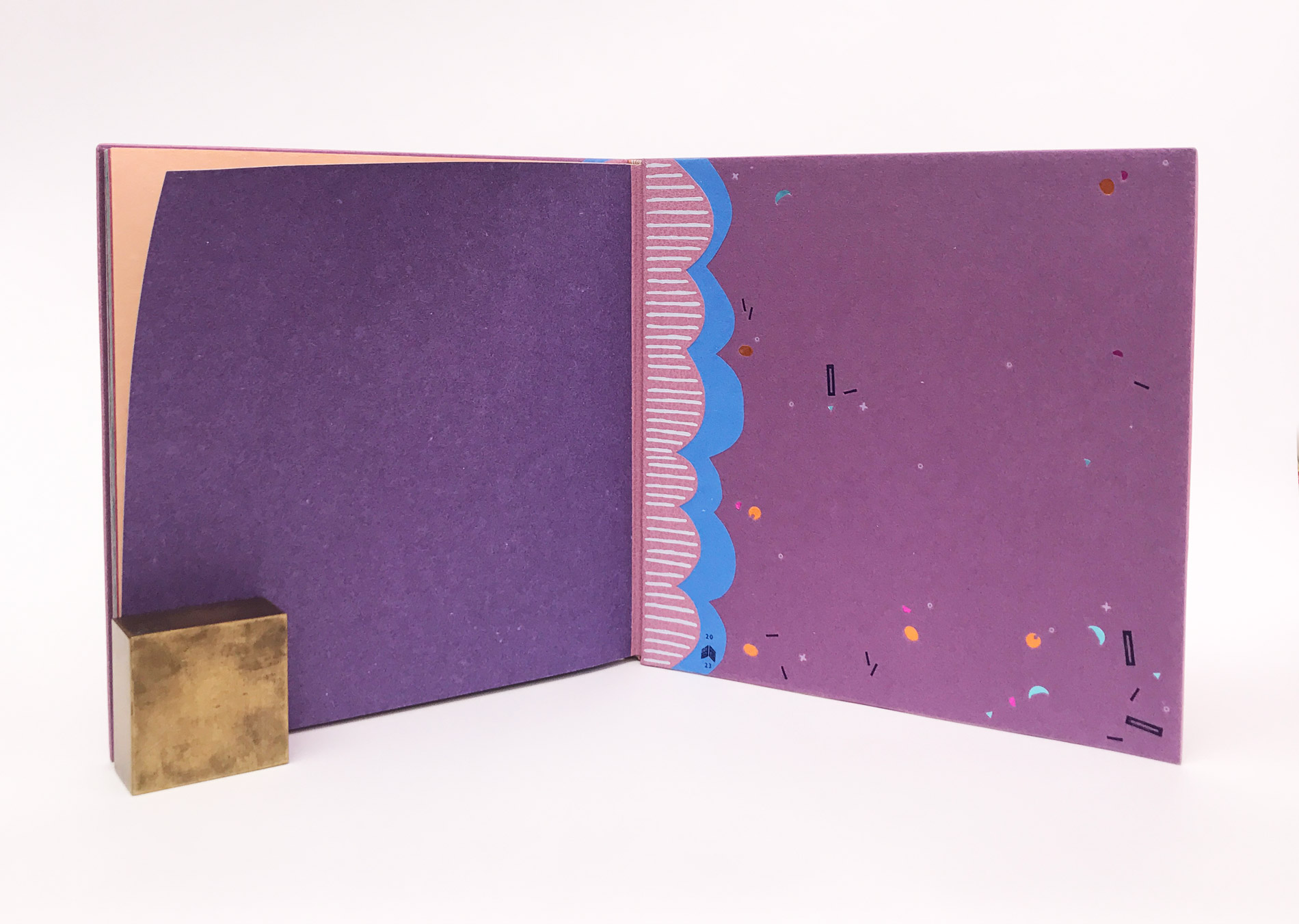Interior of The Seven Deadly Sins binding on a white table.
