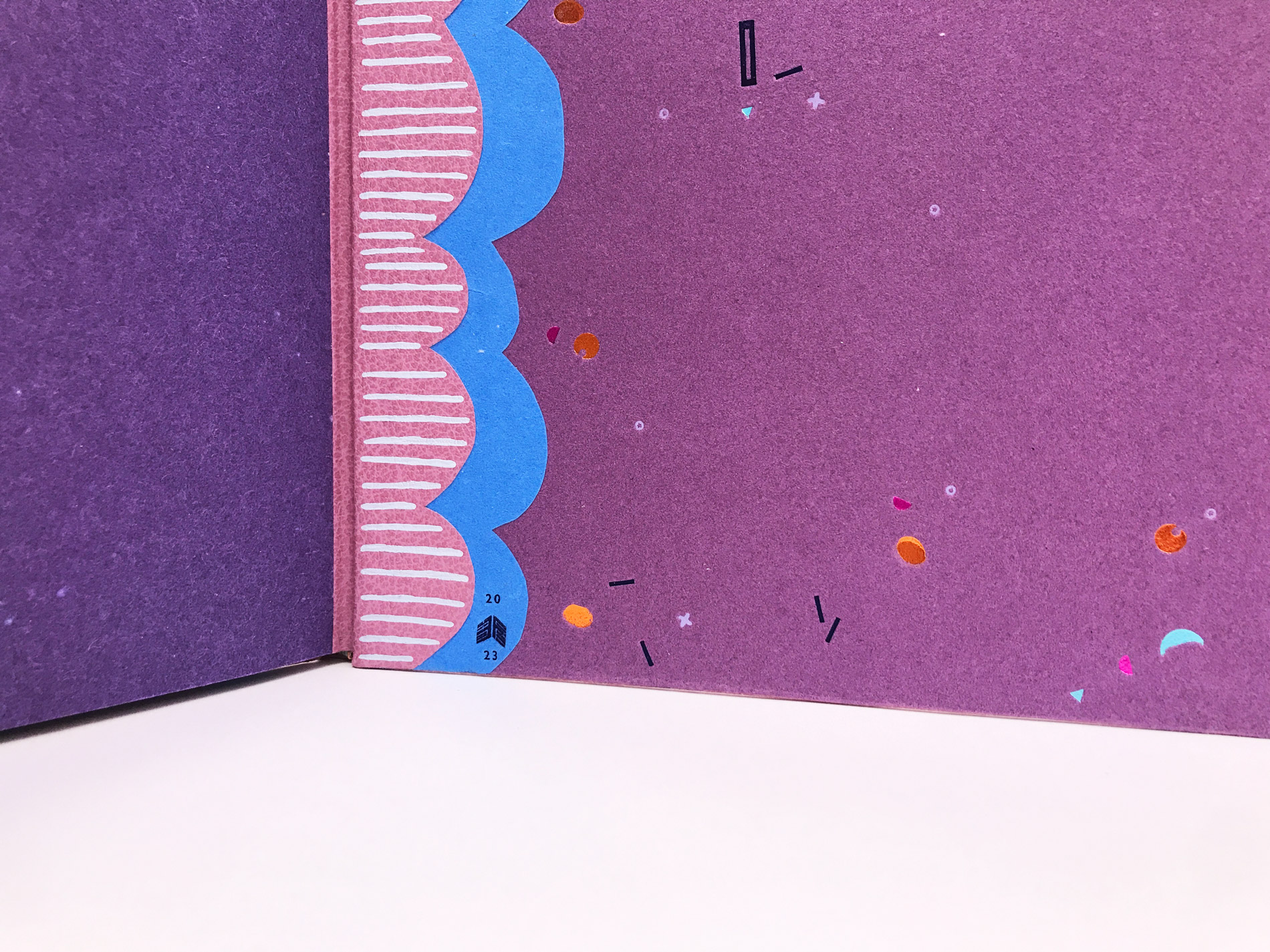 Interior of The Seven Deadly Sins binding on a white table.