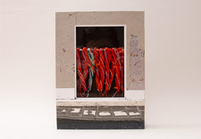 Front cover of Sheila Hicks Apprentissages binding on a white table.