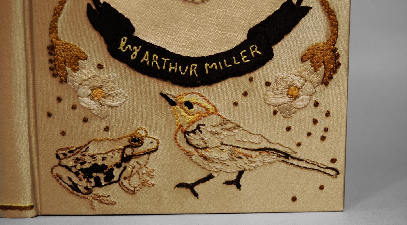 Close-up of front cover of The Crucible binding on a white table.