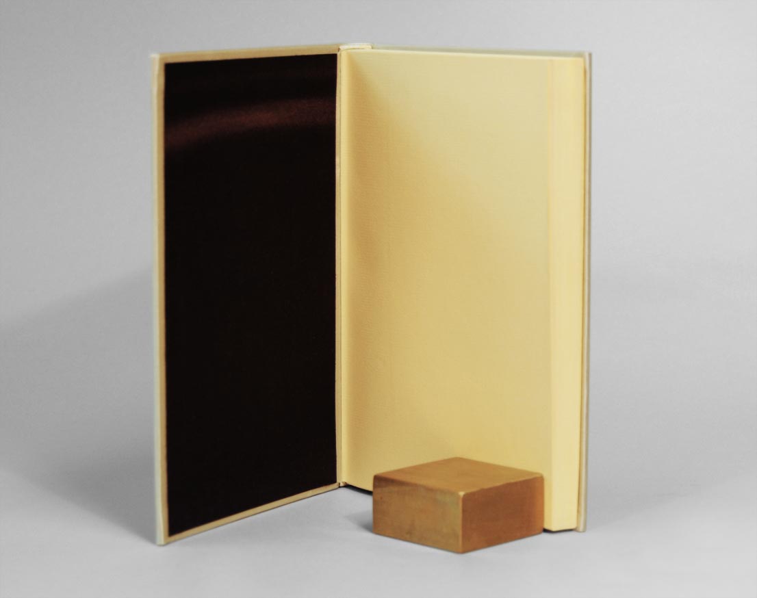 Interior of The Crucible binding on a white table.