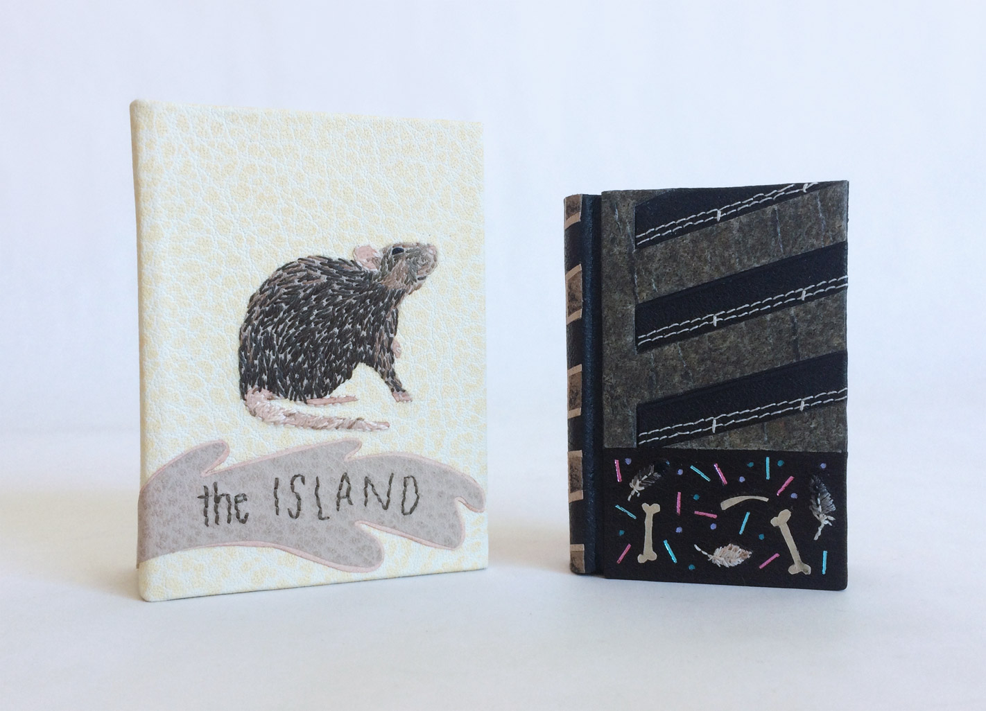 Box and The Island binding standing on a white table.