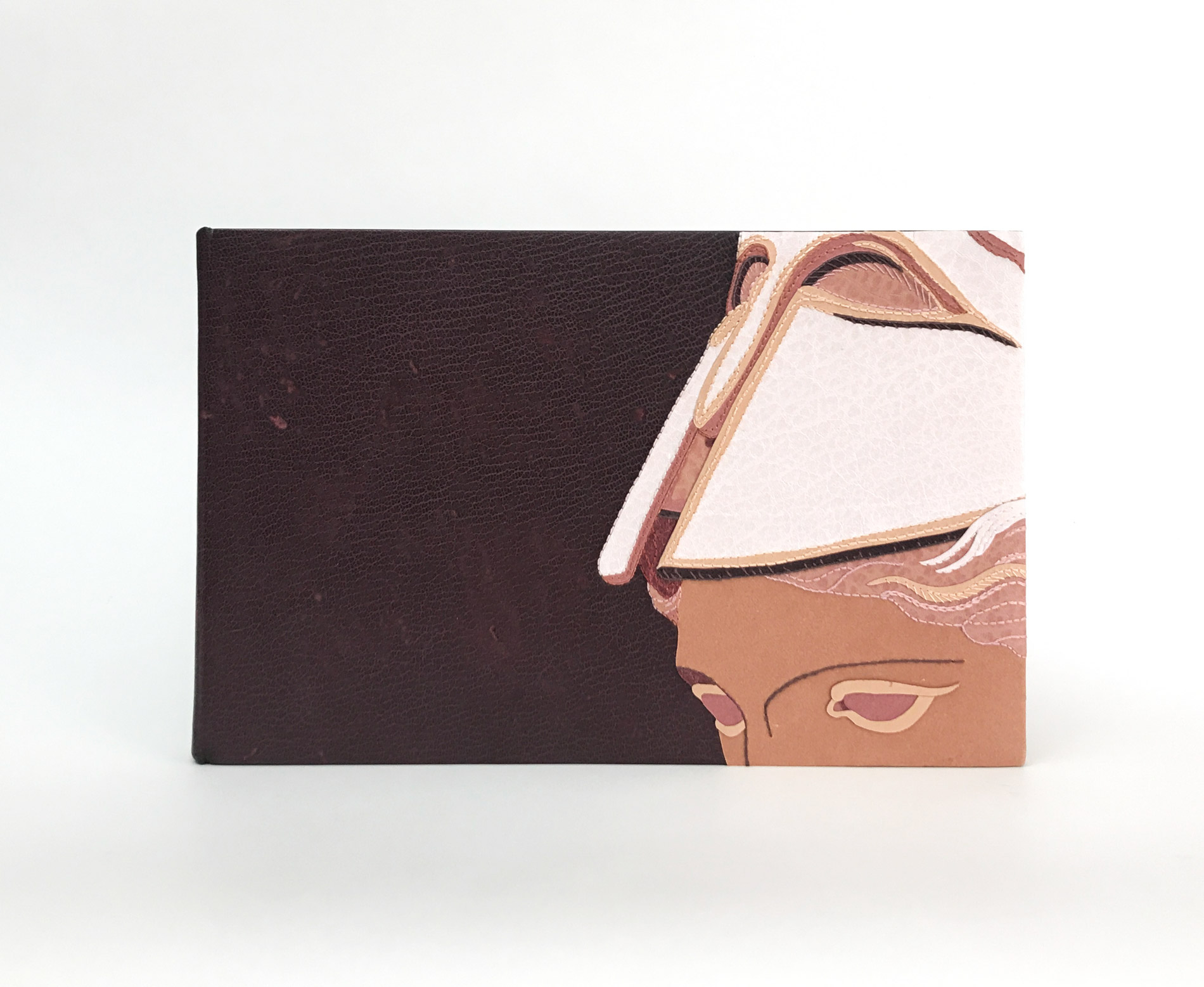 Front cover of The Raven binding on a white table.