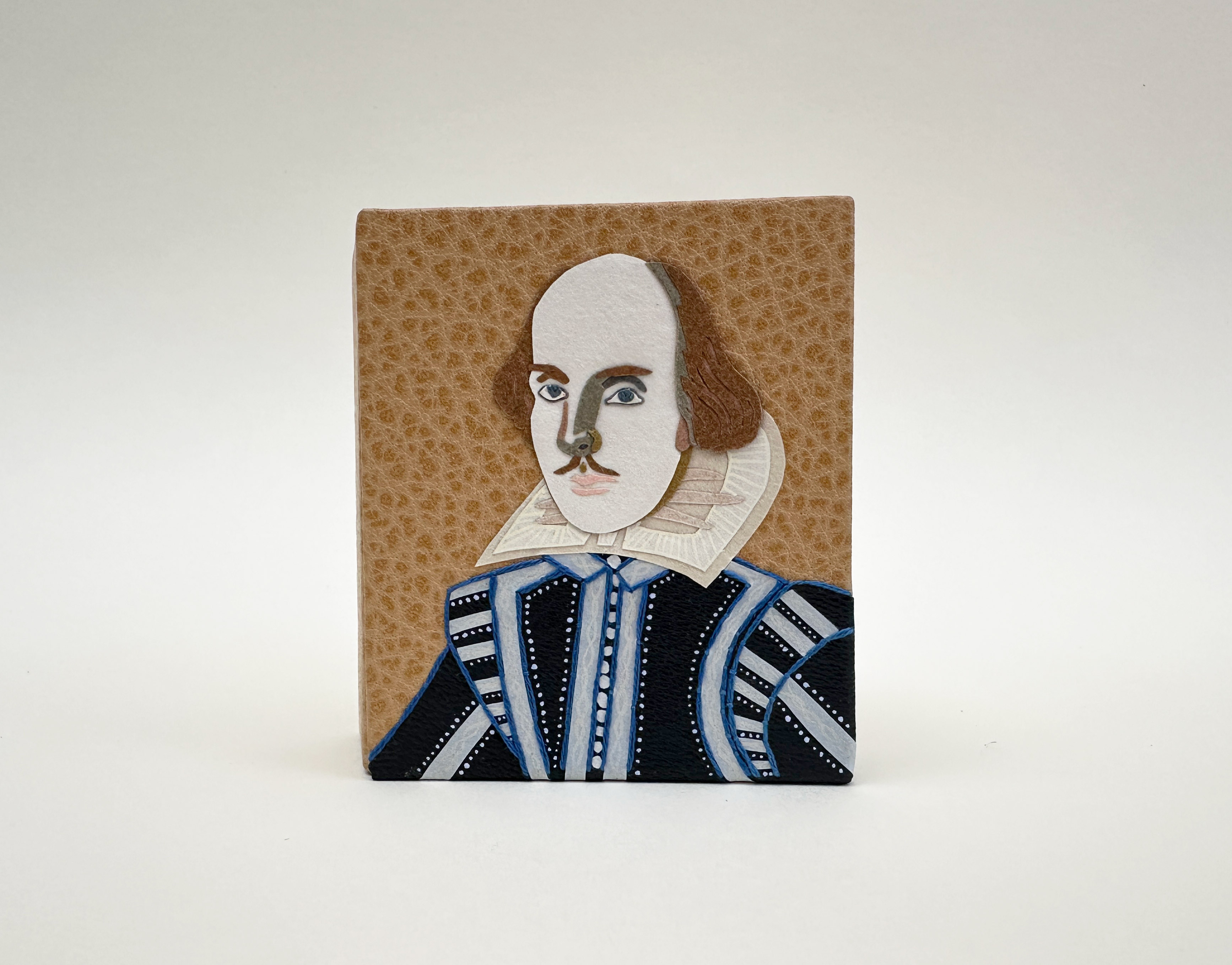 Front cover of Roadkills binding on a white table.