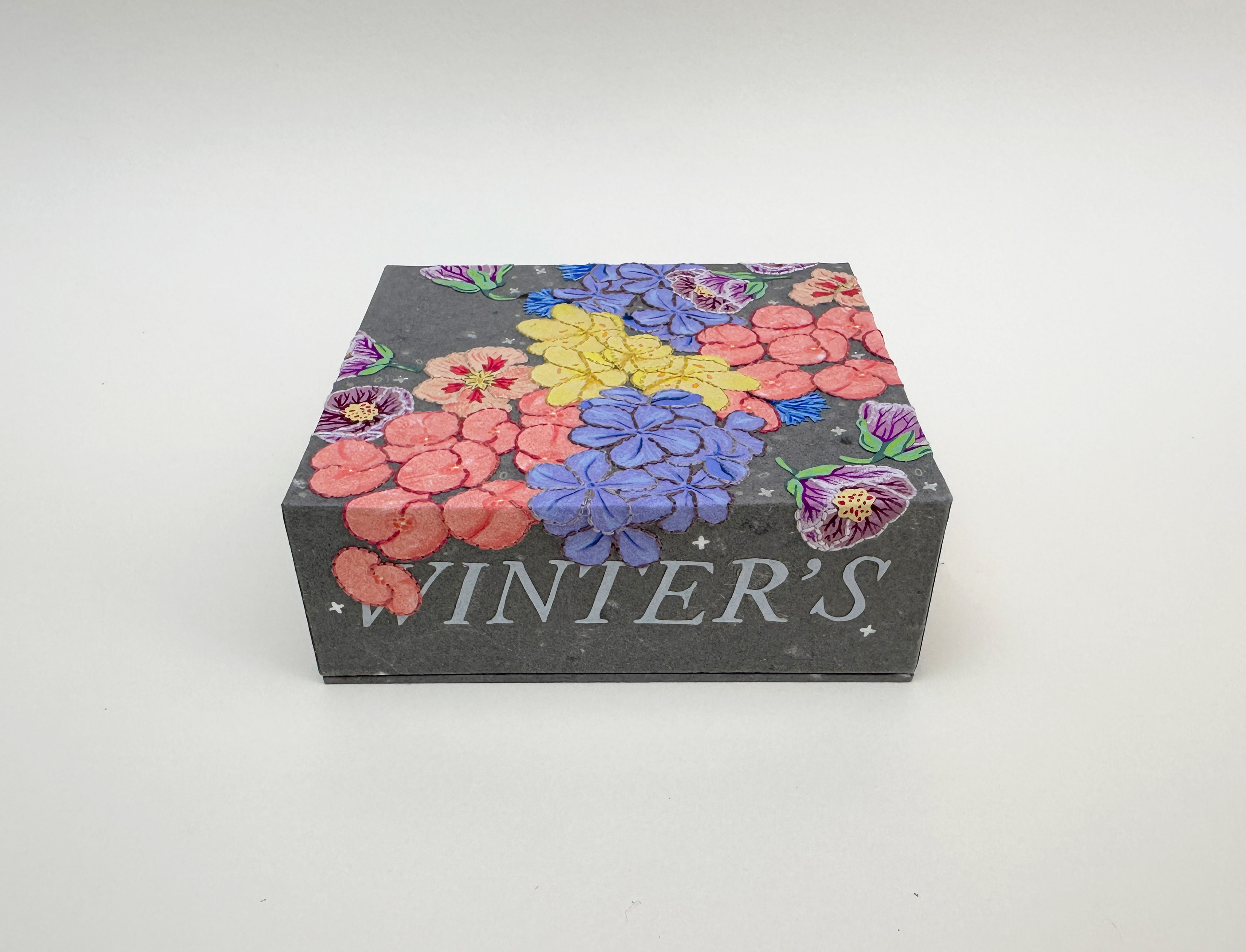 Box spine of Roadkills binding on a white table.