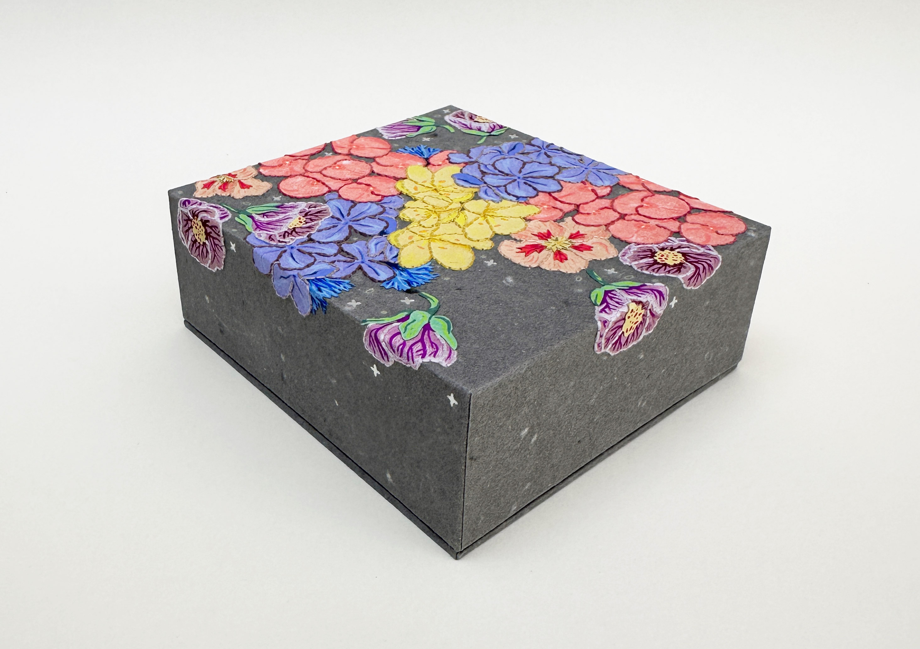 Close-up of box spine of Roadkills binding on a white table.