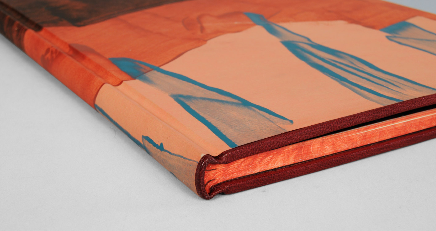 Closeup of a Millimeter Binding laying on a white table.
