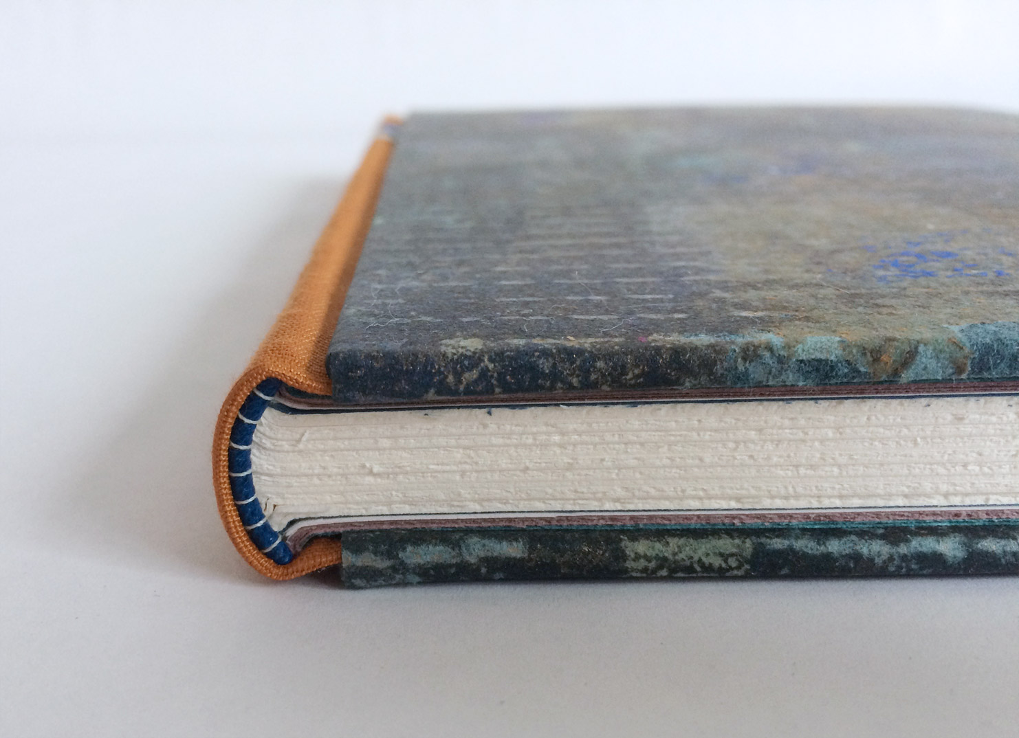 Closeup on the spine of a 3-Part Bradel Binding.