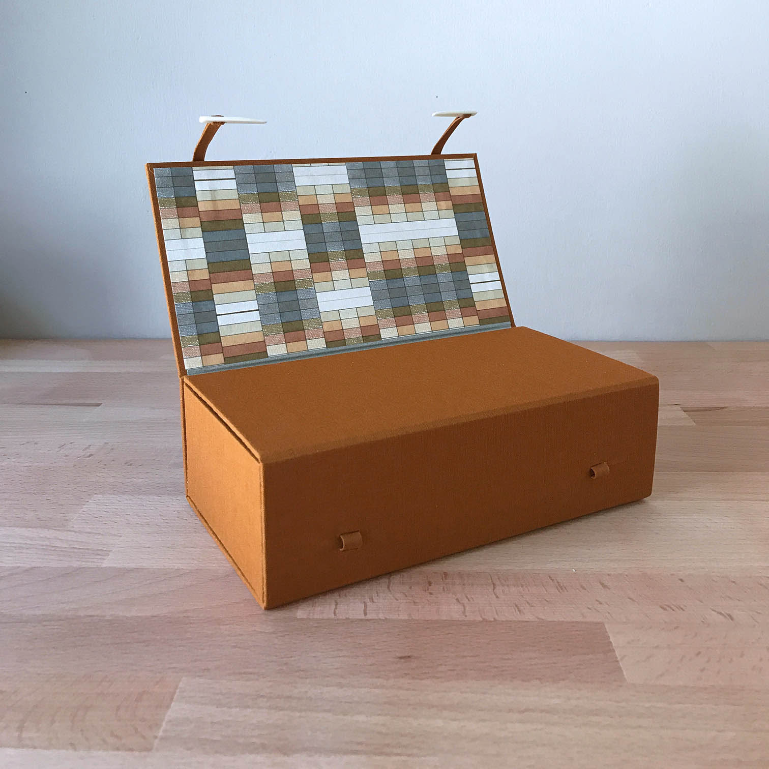 Japanese Box Case sitting on a wooden table.
