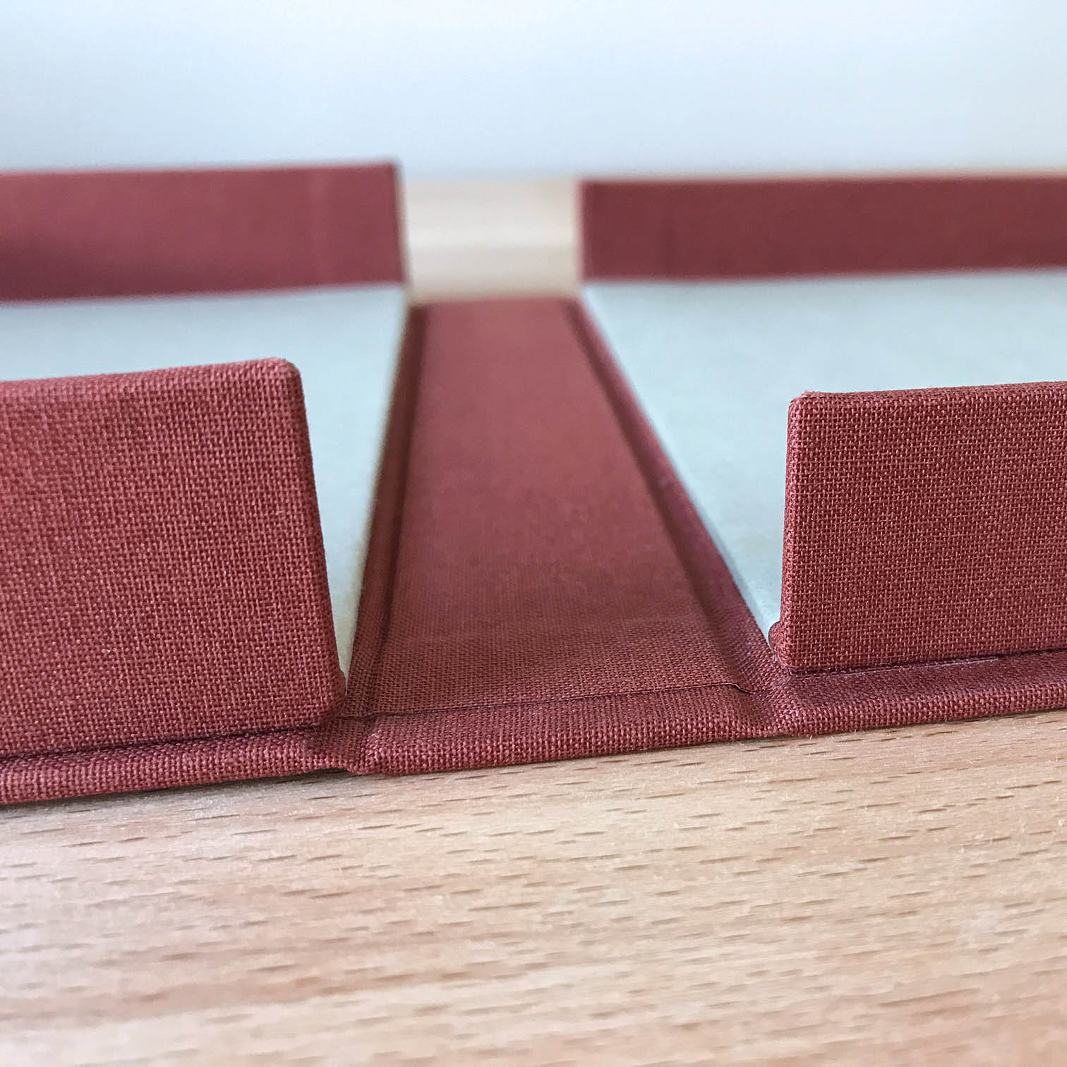 Clamshell Box sitting on a wooden table.