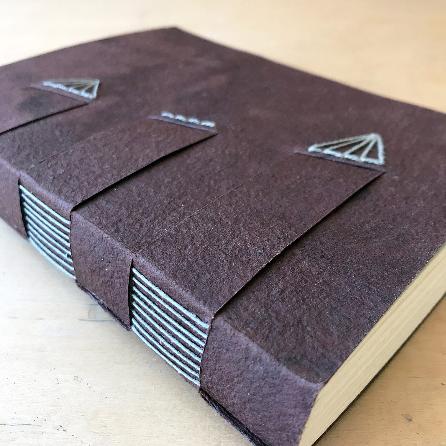 Close-up on a spine of a Cross Structure binding.