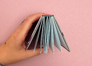 A collection of miniature bindings on a table.