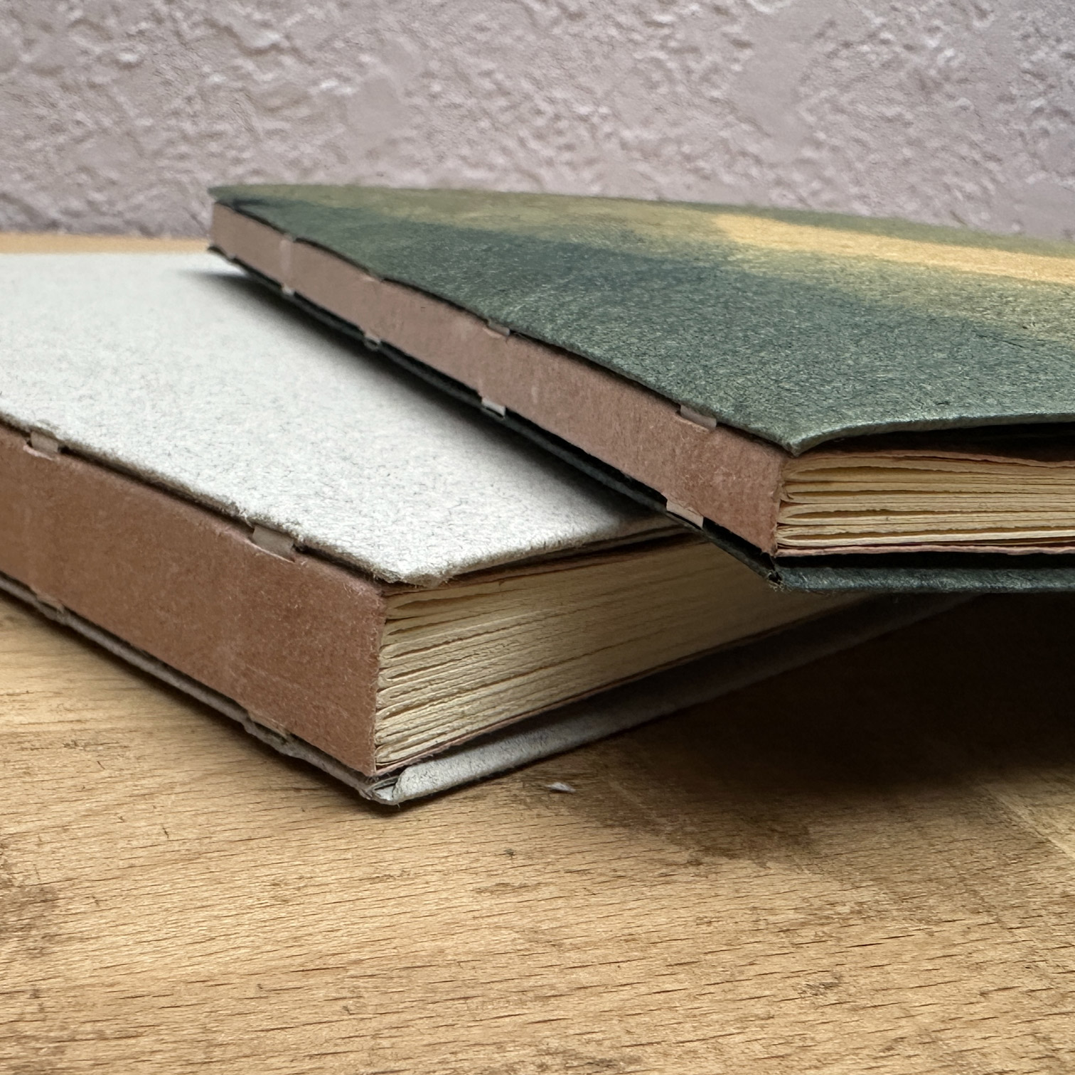Two books stacked with spines visible.