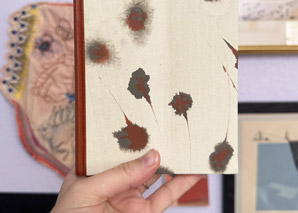 Holding up a Millimeter Binding with one hand.