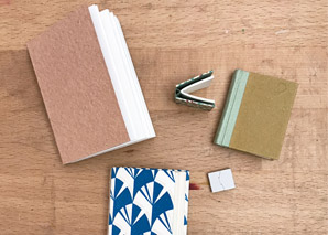 A collection of miniature bindings on a table.
